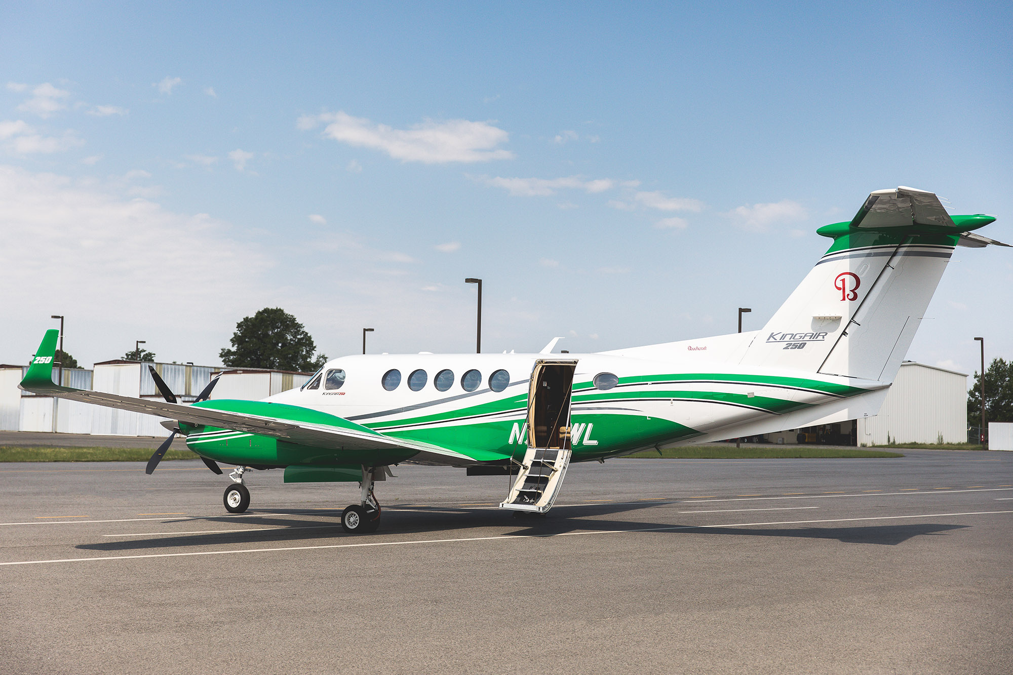 N716WL-23-charter-plane-white-and-green-exteriors-open-doorway