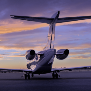 Private Jet on Runway at Sunset – Flight Group Corporation, private jet on runway at sunset, luxury aircraft at rdu airport, flight group corporation private jet charter, executive jet management services image, corporate jet waiting on tarmac, rdu luxury jet parked image, private jet photography for flight group, rdu aircraft charter sunset scene ,