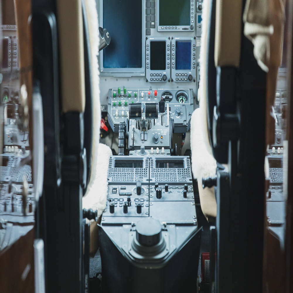 Interior view of a Beechcraft King Air cockpit with dual pilot seats and illuminated avionics., RDU Aircraft Management Services, Flight Group RDU Aircraft Management