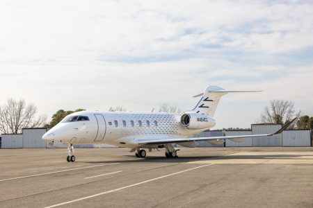 Bombardier Challenger 3500 N454CL parked on the airport apron showcasing its full side profile, swept wing design, spacious cabin dimensions, and long-range executive travel capabilities.