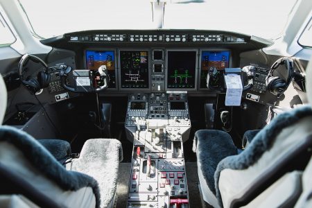 Bombardier Challenger 300 N300WK cockpit featuring advanced avionics displays, pilot workstations, and integrated flight management systems.