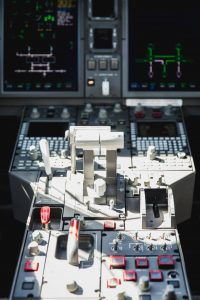 Bombardier Challenger 300 N300WK throttle quadrant and flight control systems inside the cockpit highlighting pilot interface and operational controls.