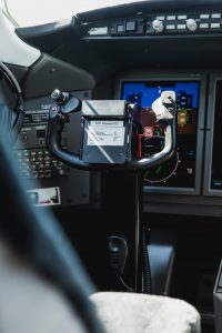 Bombardier Challenger 300 N300WK cockpit display screens and control yoke showcasing integrated avionics and navigation systems.