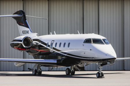 Bombardier Challenger 300 N300WK forward exterior view displaying its fuselage, engine nacelles, and executive aviation design.